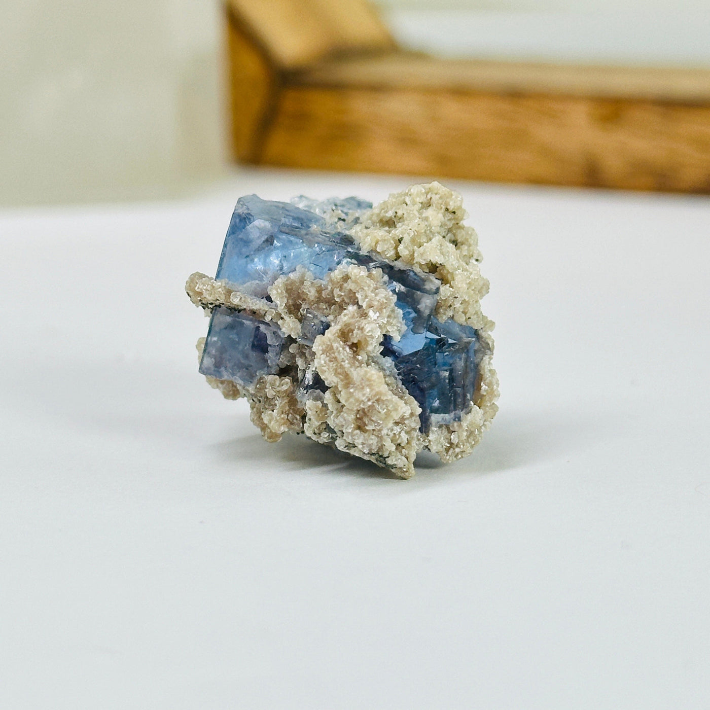 blue fluorite with decorations in the background