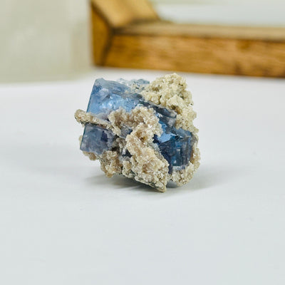 blue fluorite with decorations in the background