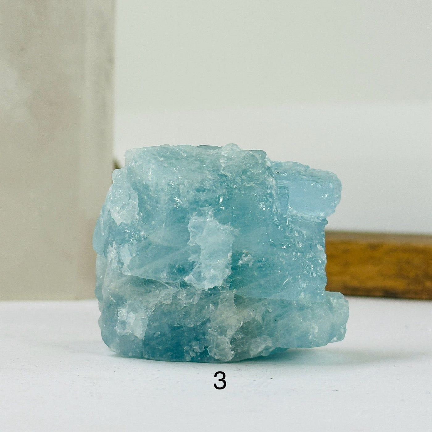 aquamarine stone with decorations in the background