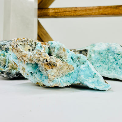 blue aragonite with decorations in the background