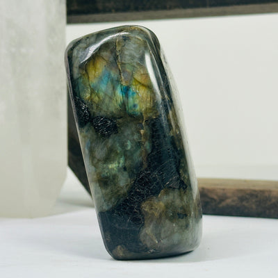 labradorite with decorations in the background