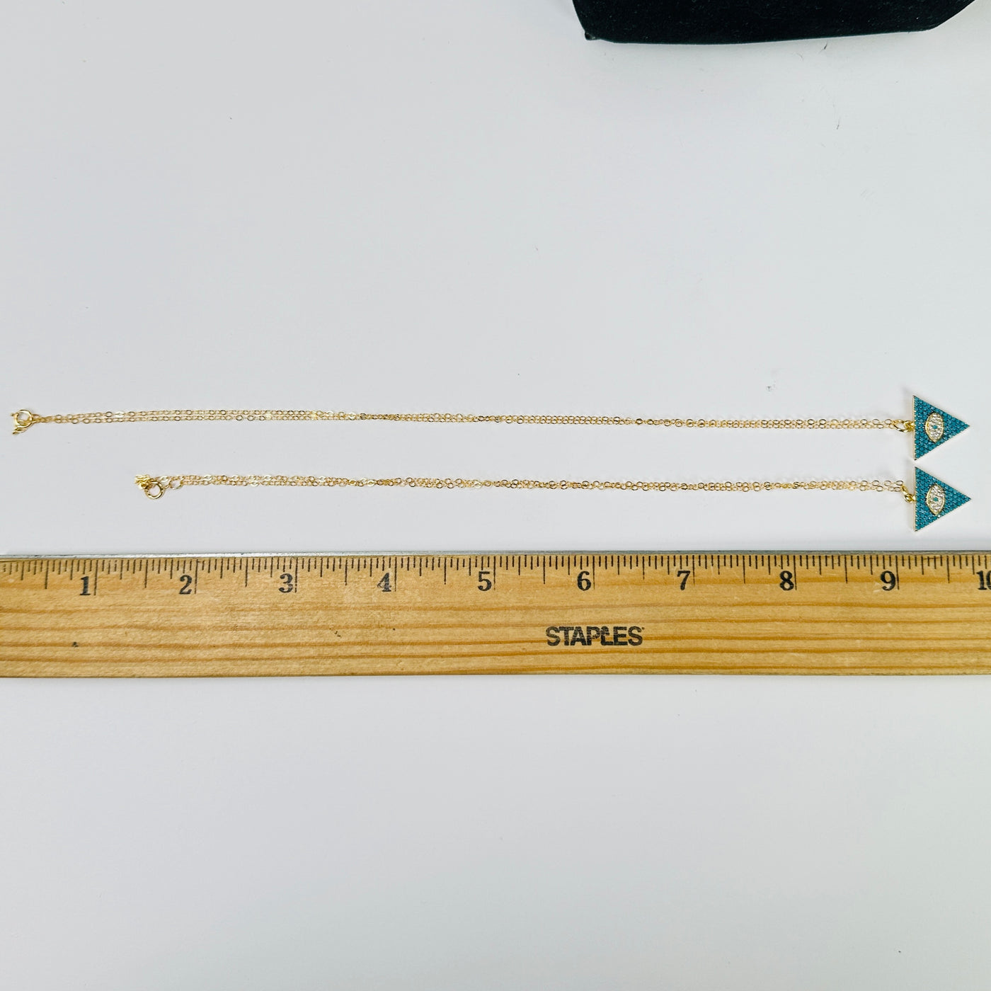 howlite necklace next to a ruler for size reference