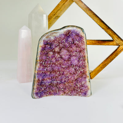 amethyst cut base with decorations in the background