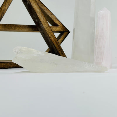 crystal quartz with decorations in the background