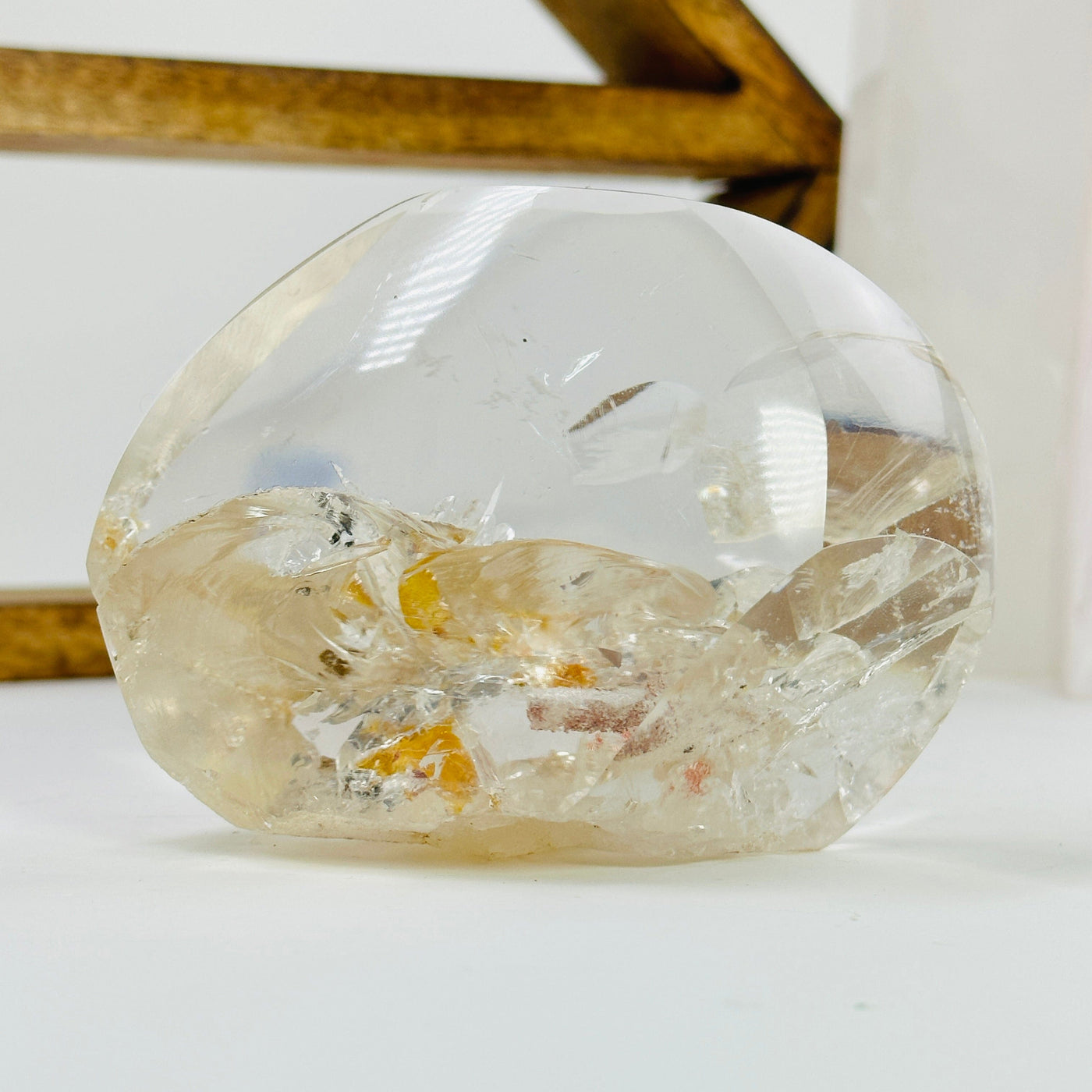 crystal quartz with inclusions with decorations in the background