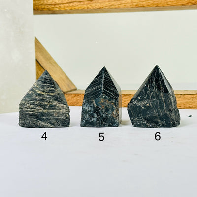 tourmaline points with decorations in the background