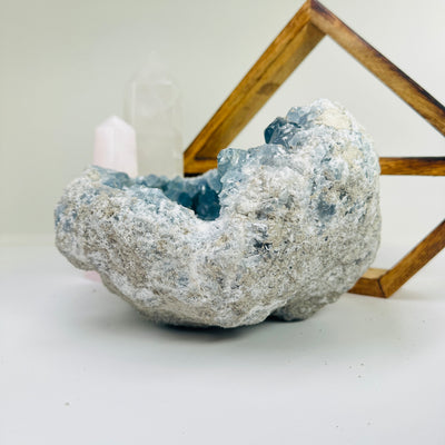 Celestite with decorations in the background