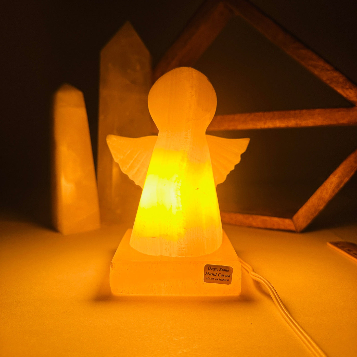 onyx angel lamp with decorations in the background