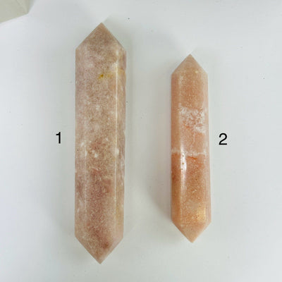 pink amethyst points with decorations in the background