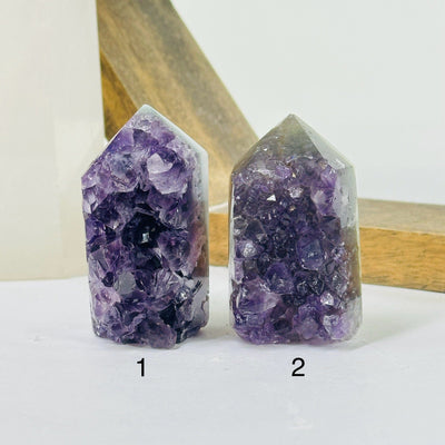 amethyst point with decorations in the background