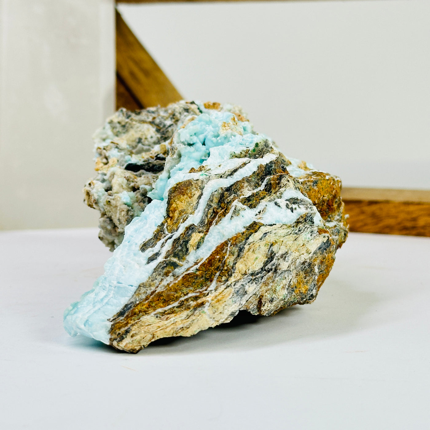 blue aragonite with decorations in the background