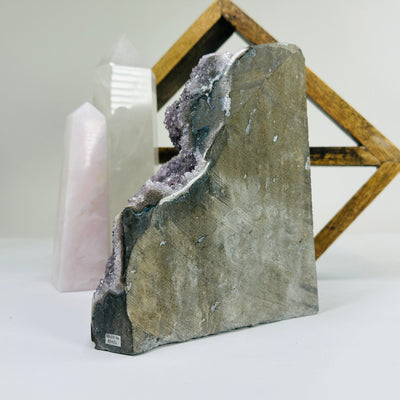 amethyst cut base with decorations in the background