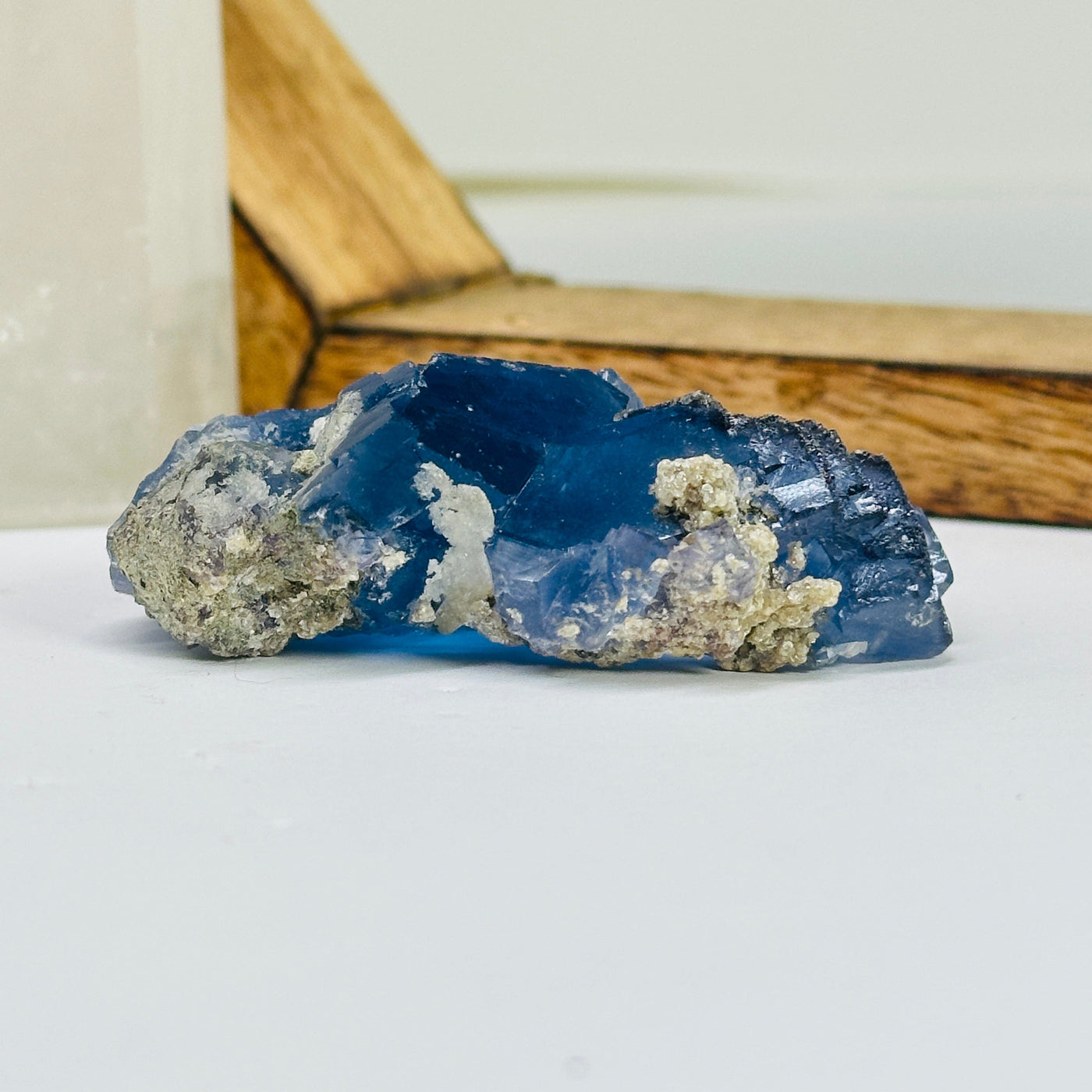 blue fluorite with decorations in the background