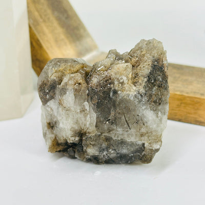 rutile quartz with decorations in the background