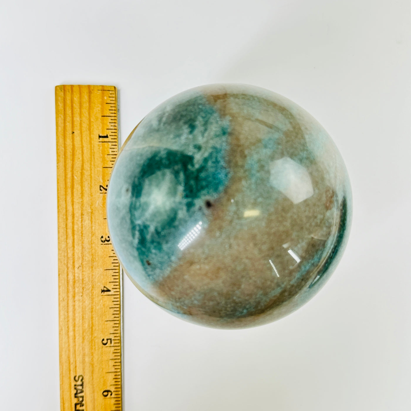 trolleite sphere next to a ruler for size reference