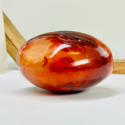 carnelian heart with decorations in the background