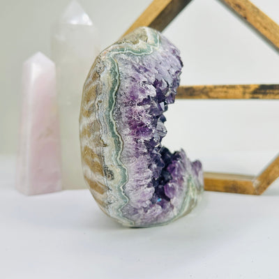 amethyst freeform with decorations in the background