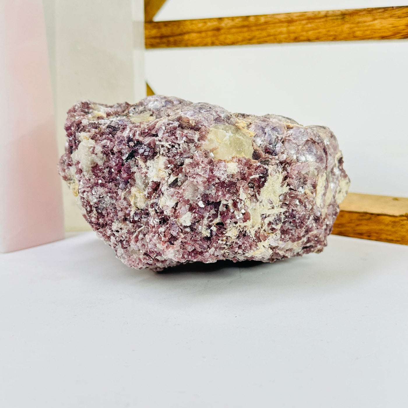 lepidolite with decorations in the background