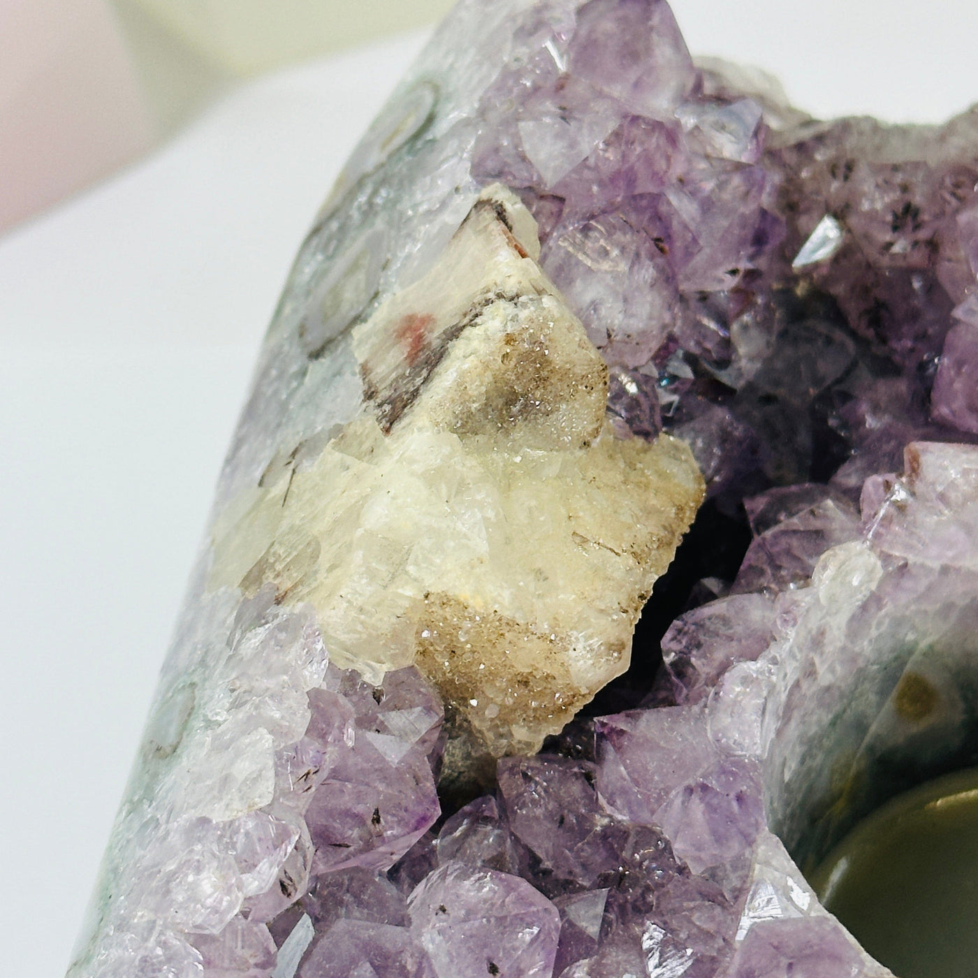 amethyst candle holder with decorations in the background