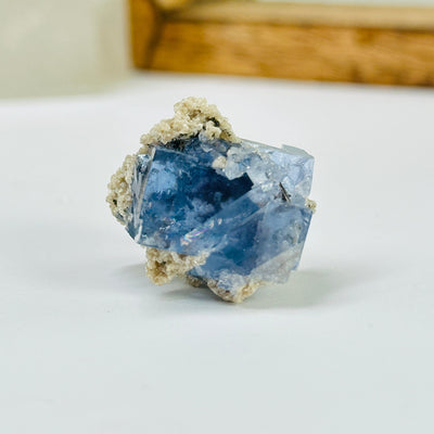 blue fluorite with decorations in the background