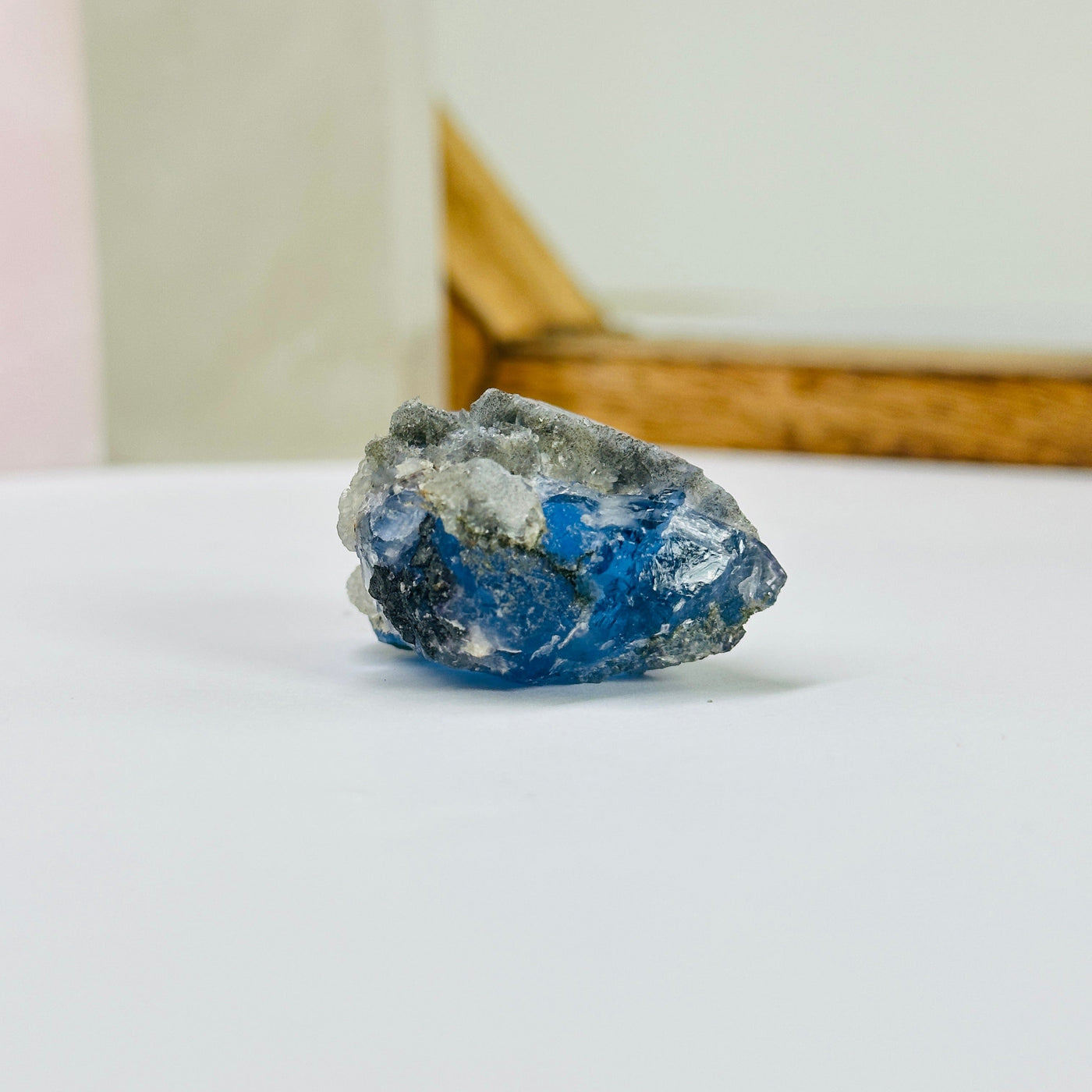 blue fluorite with decorations in the background