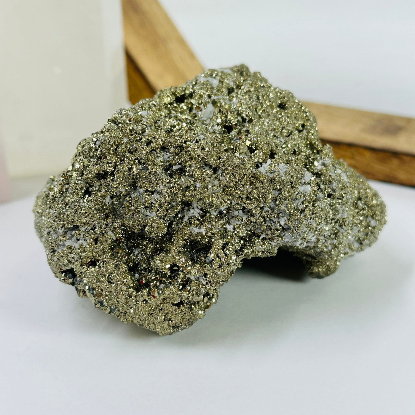 pyrite cluster with decorations in the background
