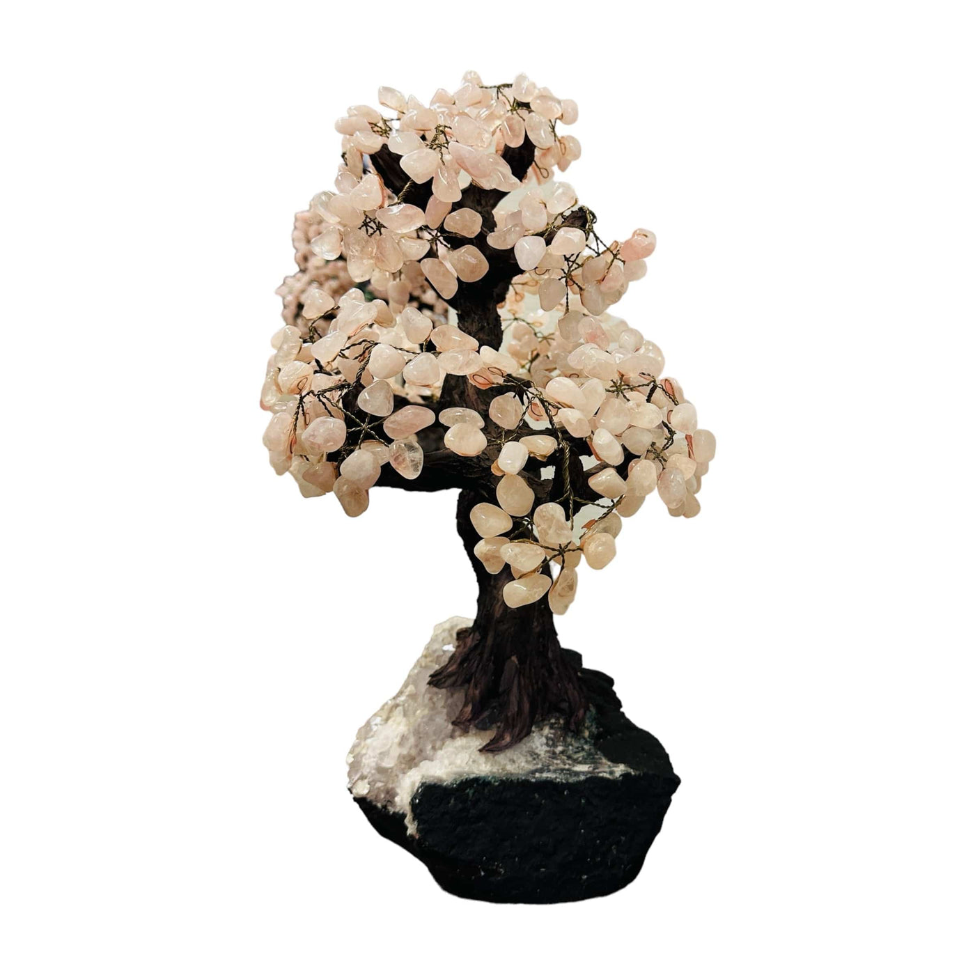 rose quartz tree on amethyst base on white background