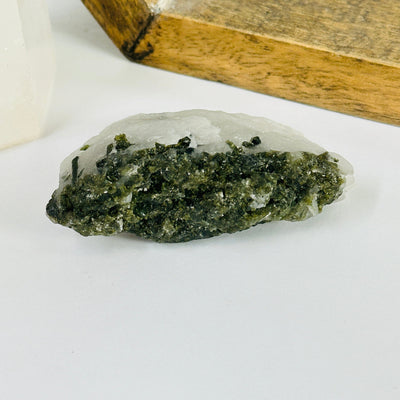 epidote with decorations in the background