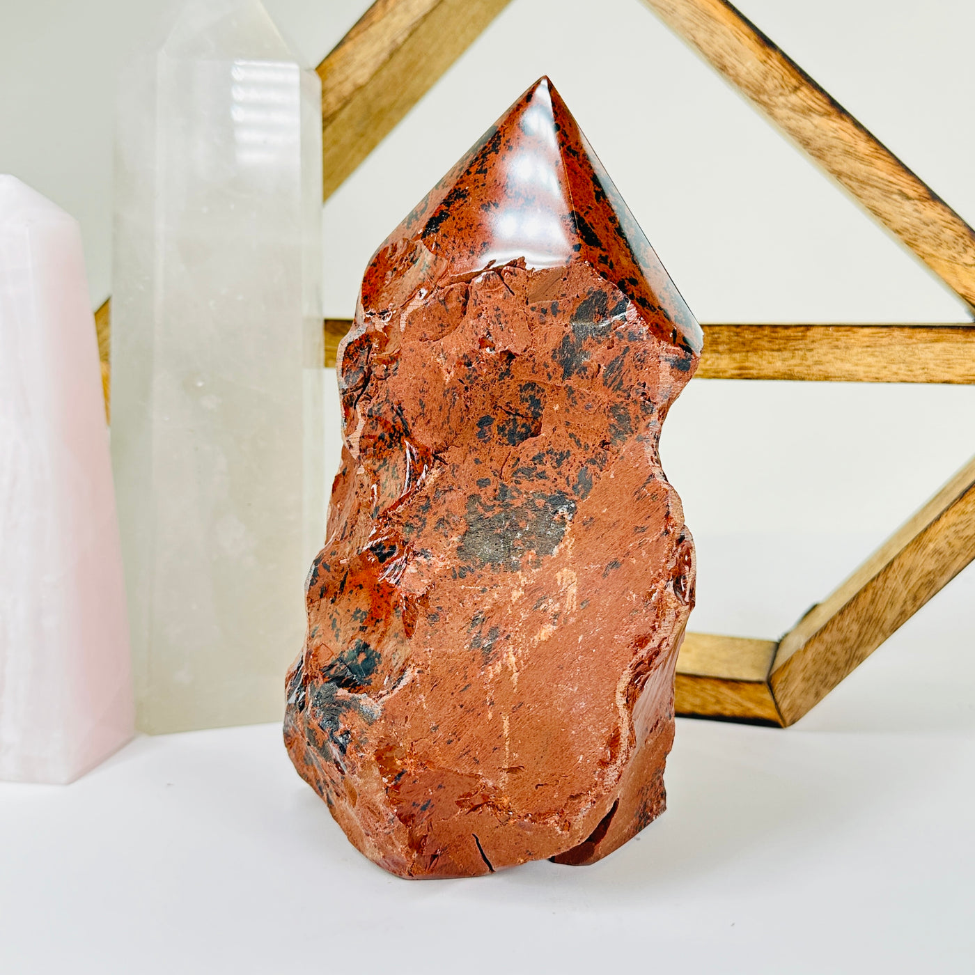 Mahogany obsidian with decorations in  the background