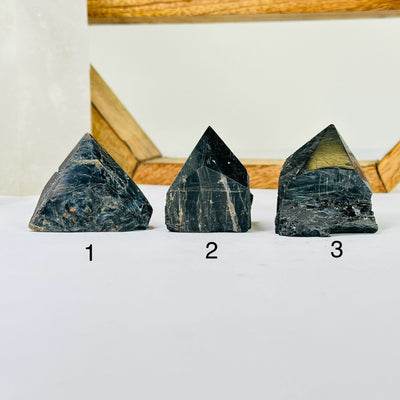 tourmaline points with decorations in the background