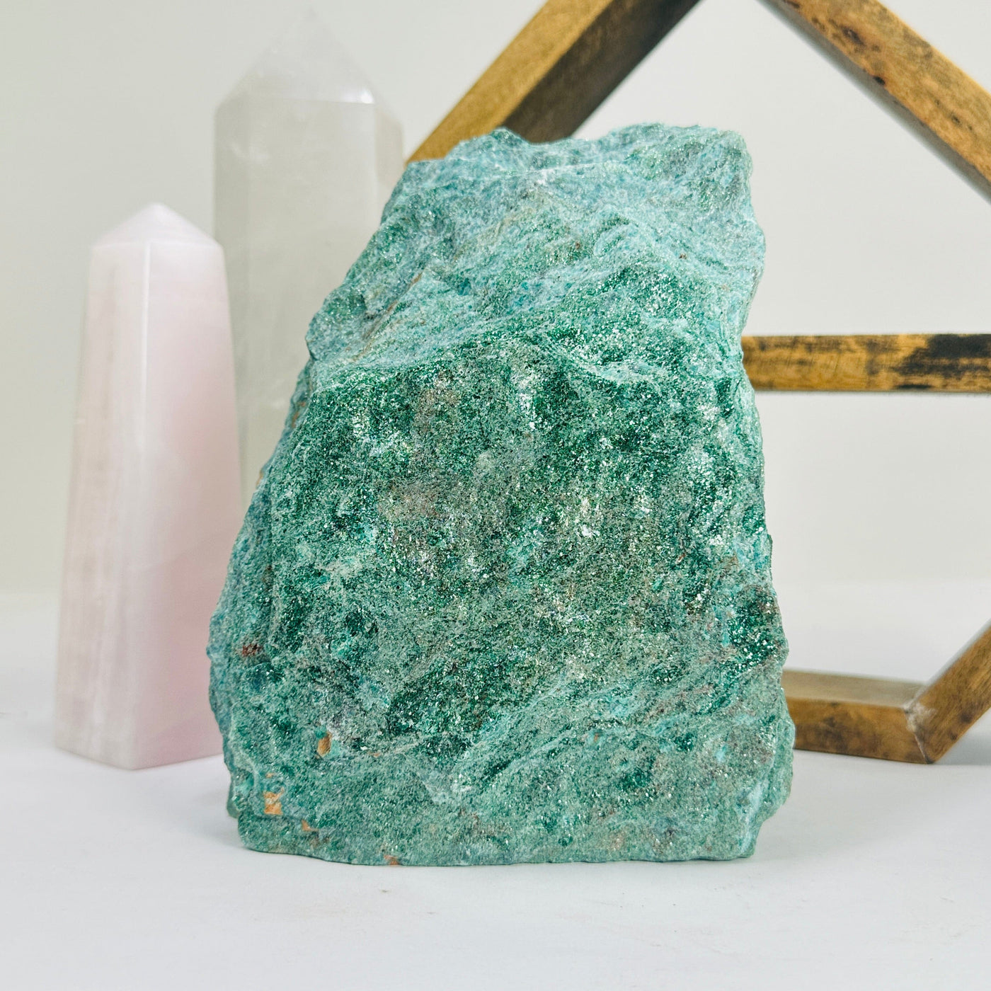 fuchsite cut base with decorations in the background