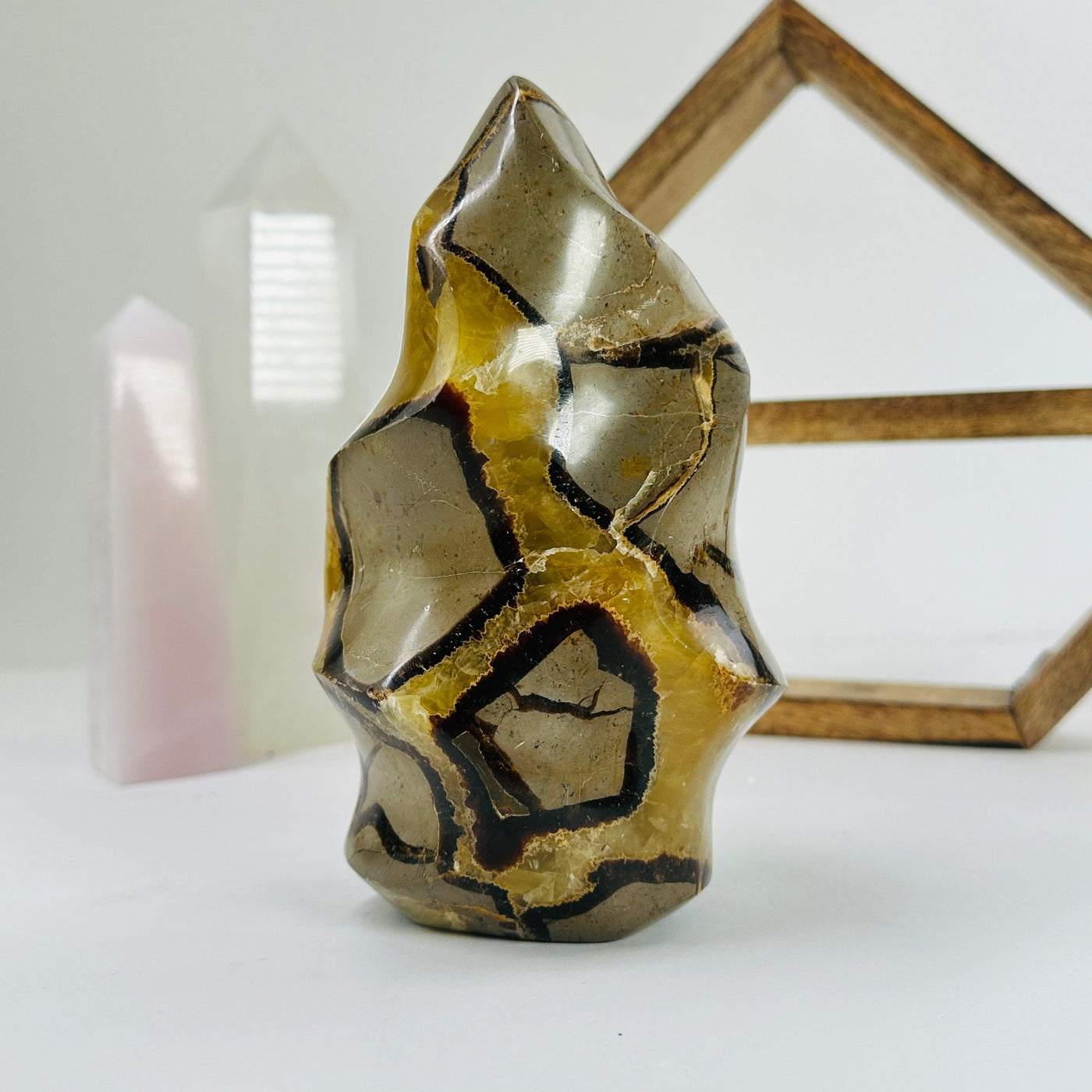 septarian flame point with decorations in the background