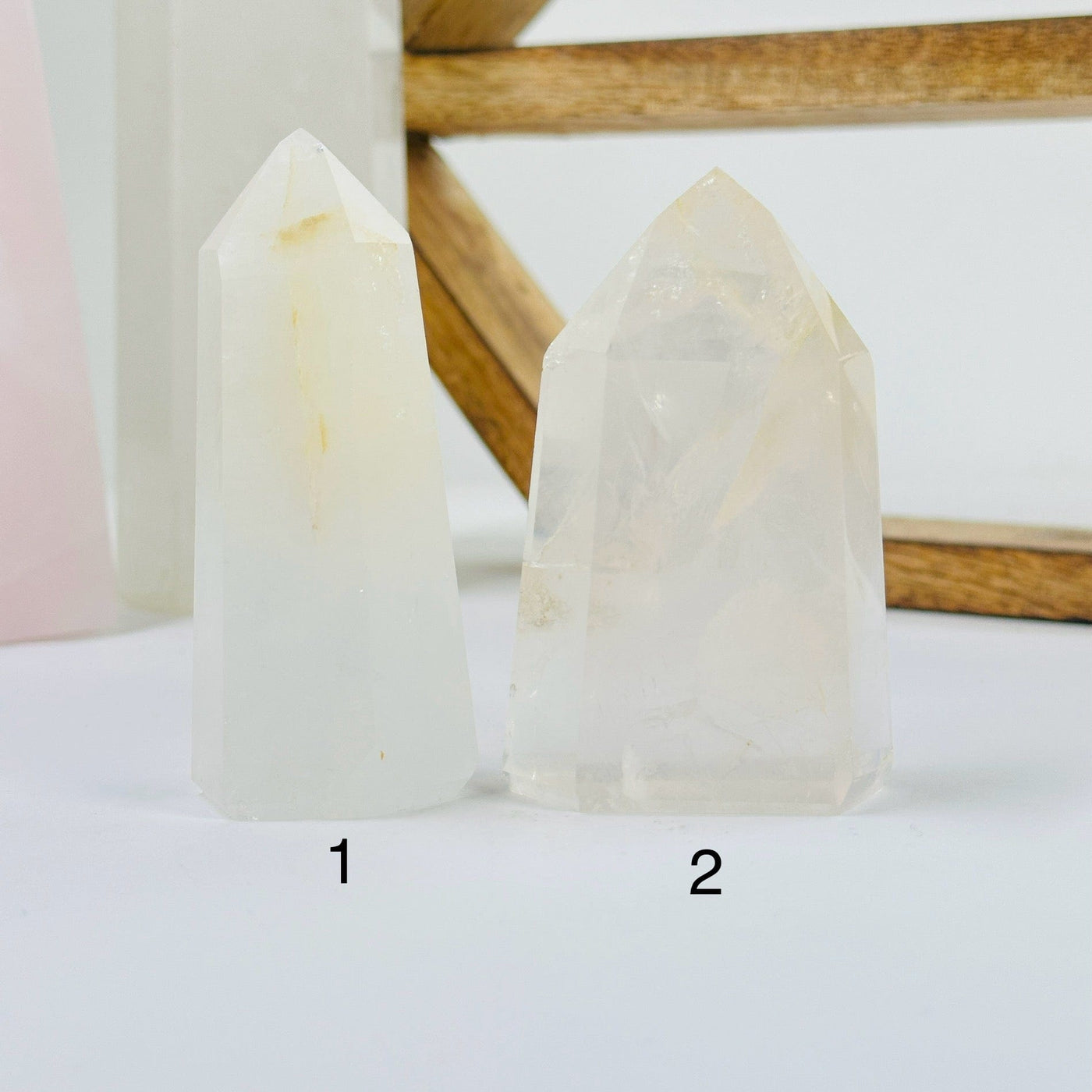 crystal quartz points with decorations in the background