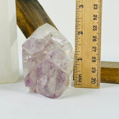 amethyst point with decorations in the background