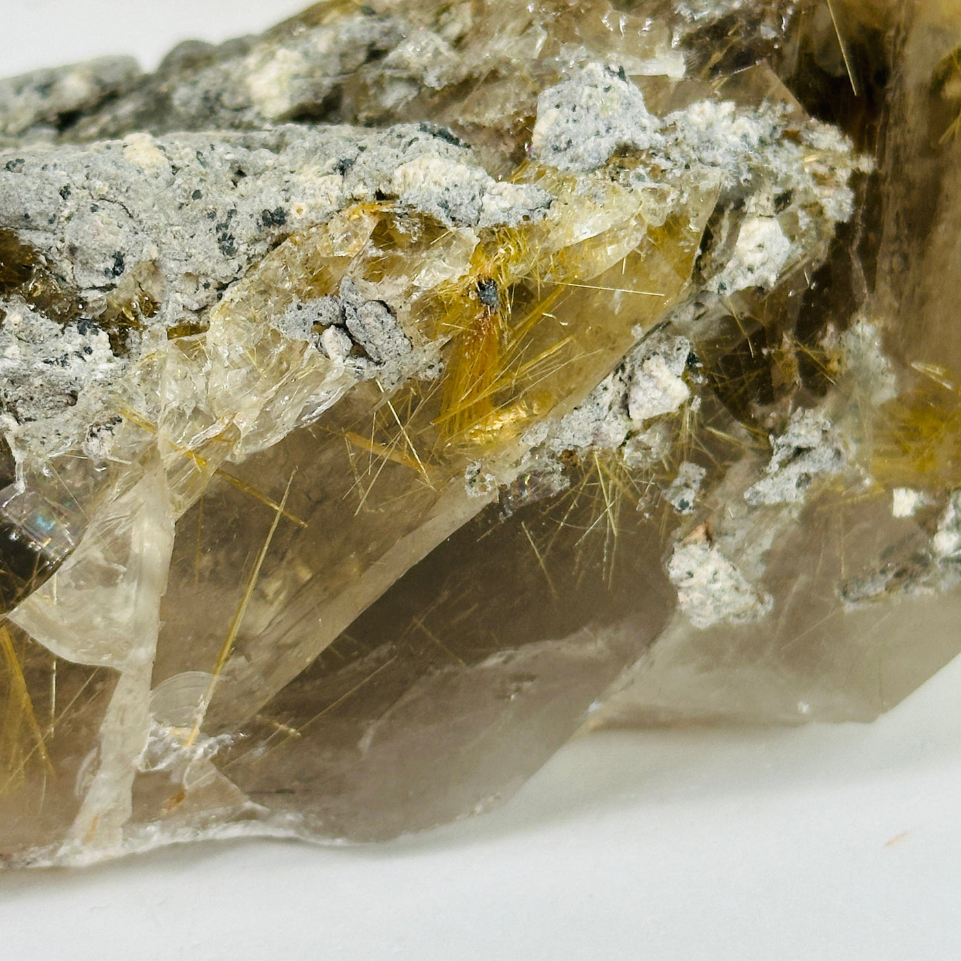 rutile quartz with decorations in the background