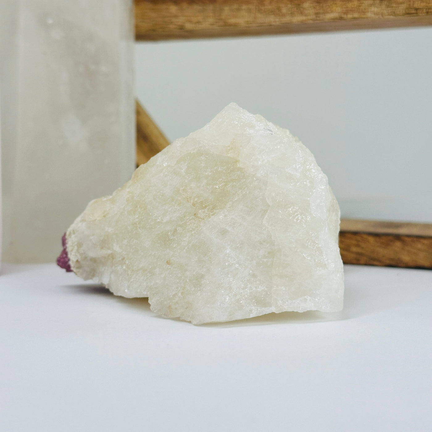 watermelon tourmaline with decorations in the background