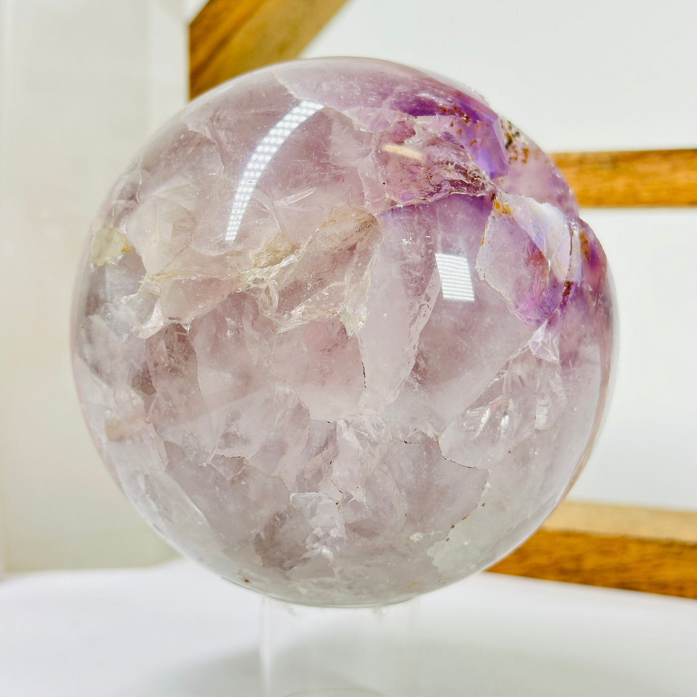 amethyst sphere with decorations in the background