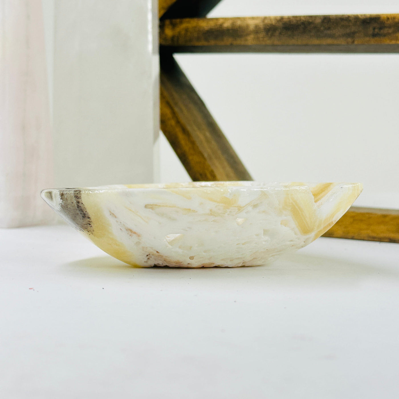 Mexican onyx bowl with decorations in the background