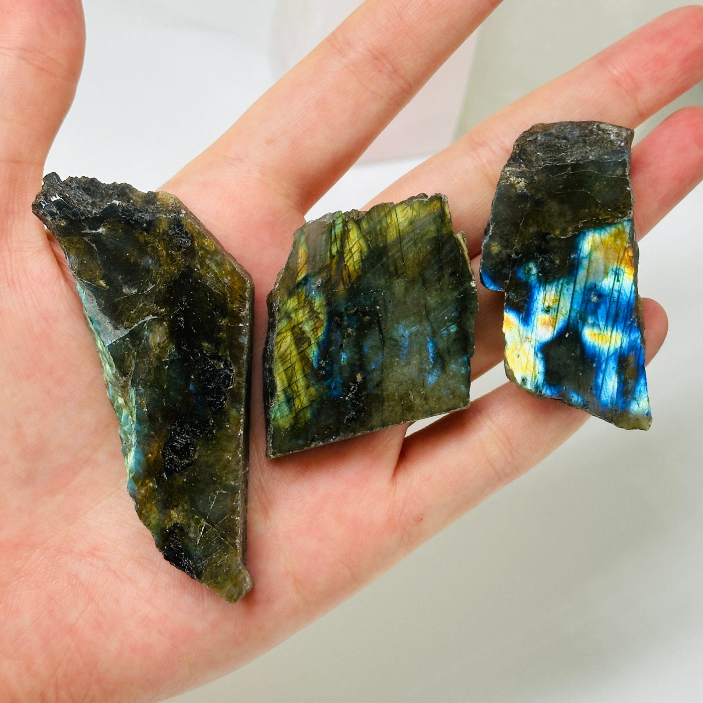 labradorite slab with decorations in the background