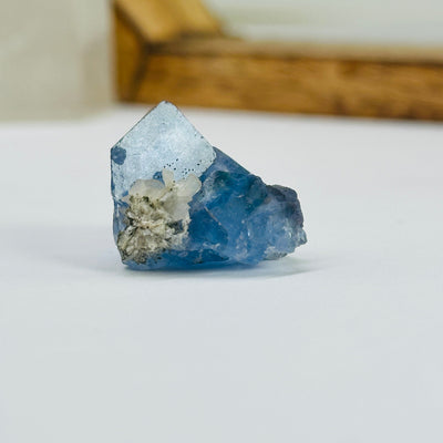 blue fluorite with decorations in the background