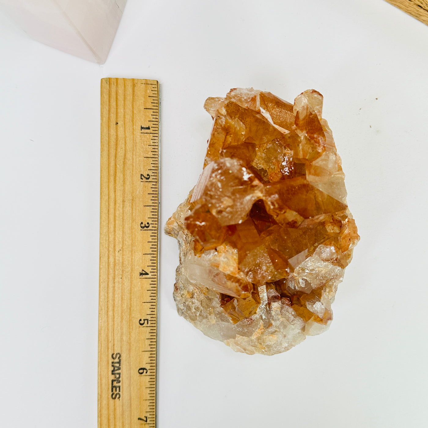 tangerine quartz with decorations in the background