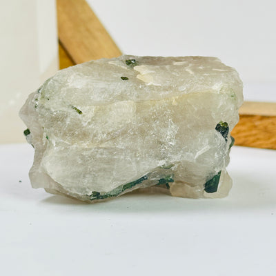 tourmaline with decorations in the background