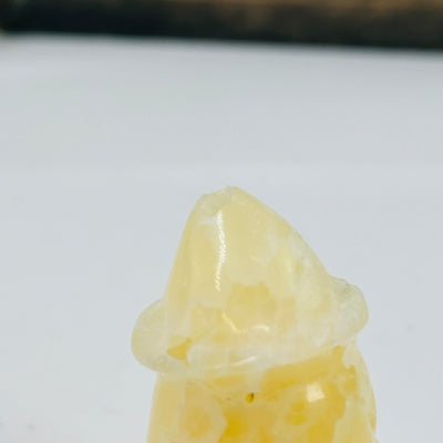 CALCITE GHOST WITH DECORATIONS IN THE BACKGROUND