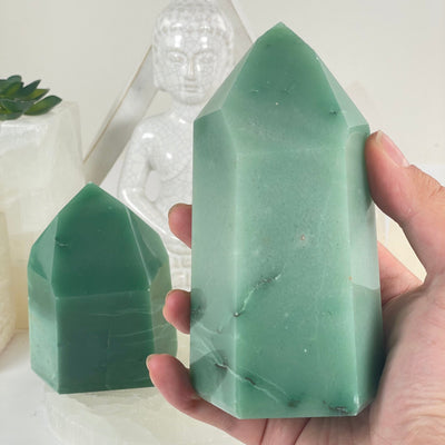 Green Quartz Polished Crystal Point - You Choose one variant in hand for size reference with other variant in the background