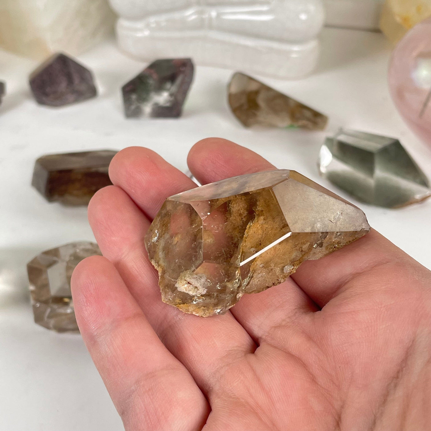 Garden Quartz Lodalite Polished Crystal Prism in a hand for size reference