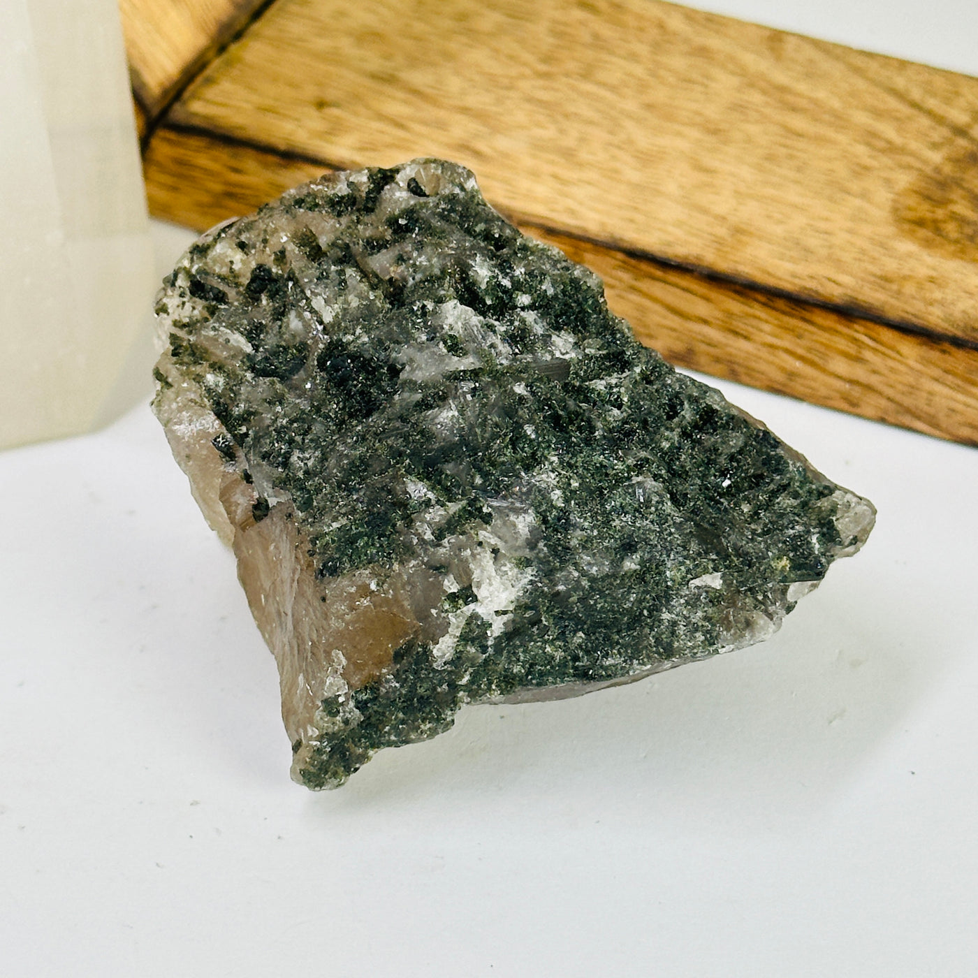 tourmaline with decorations in the background