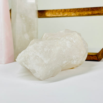 crystal quartz with decorations in  the background