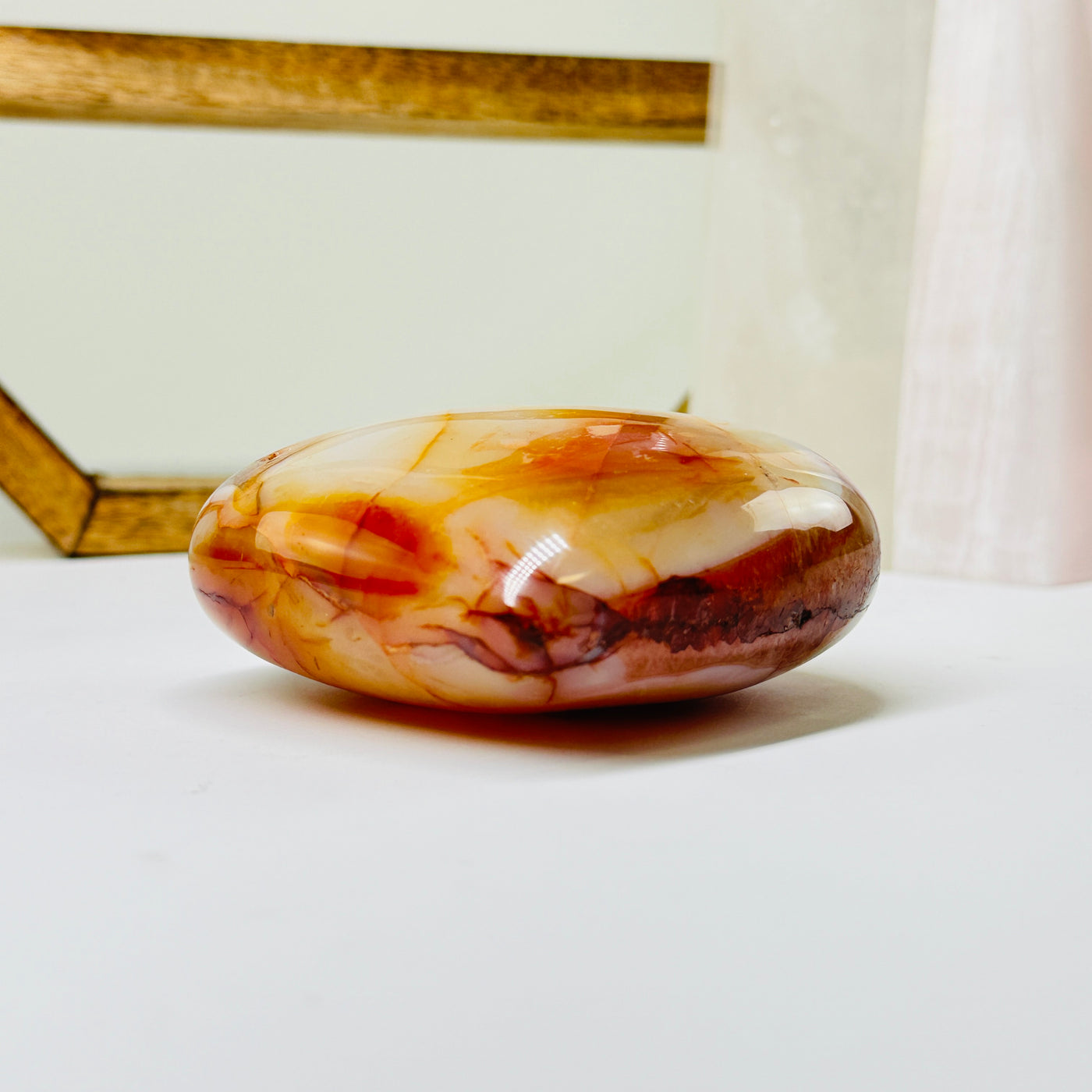 carnelian heart with decorations in the background