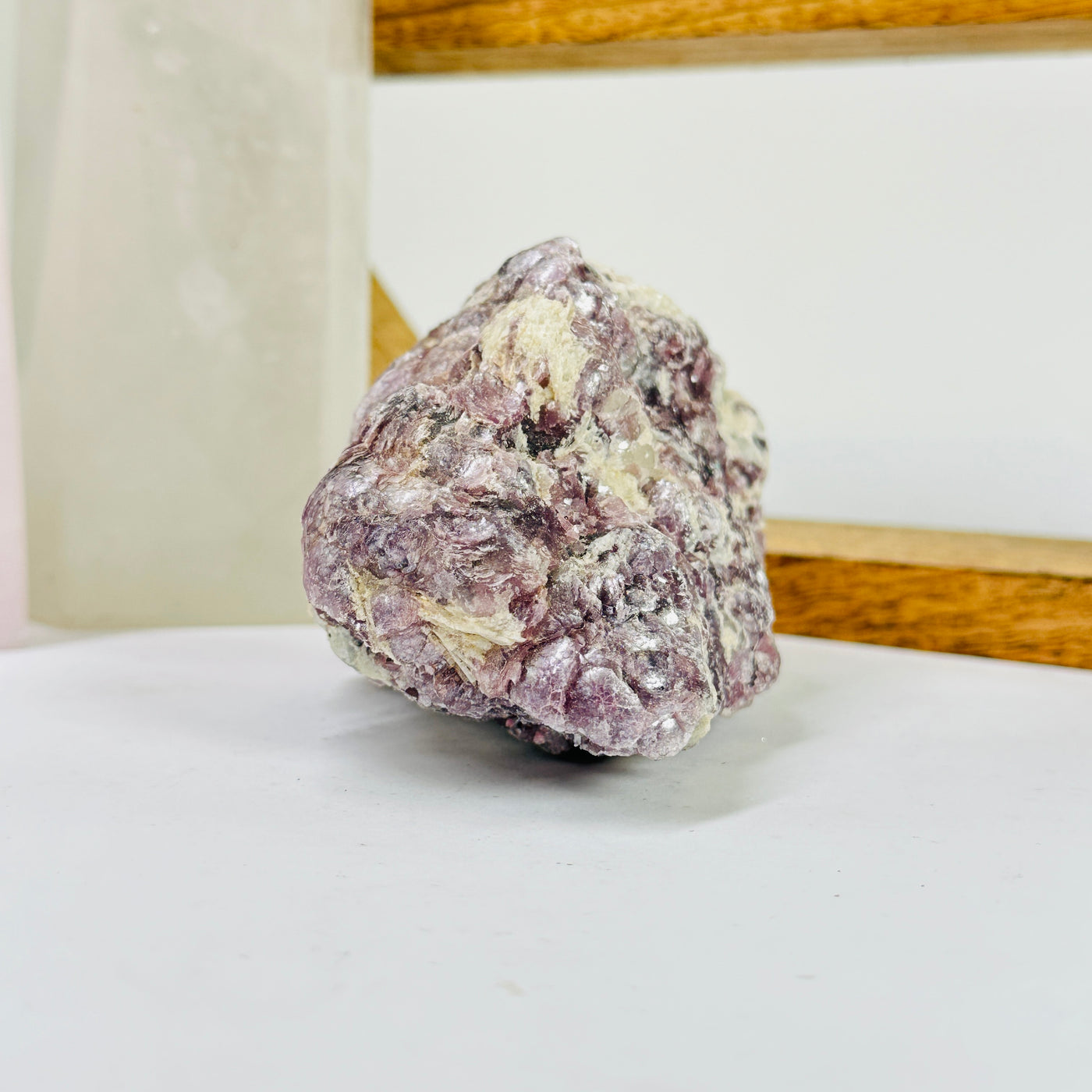 lepidolite with decorations in the background