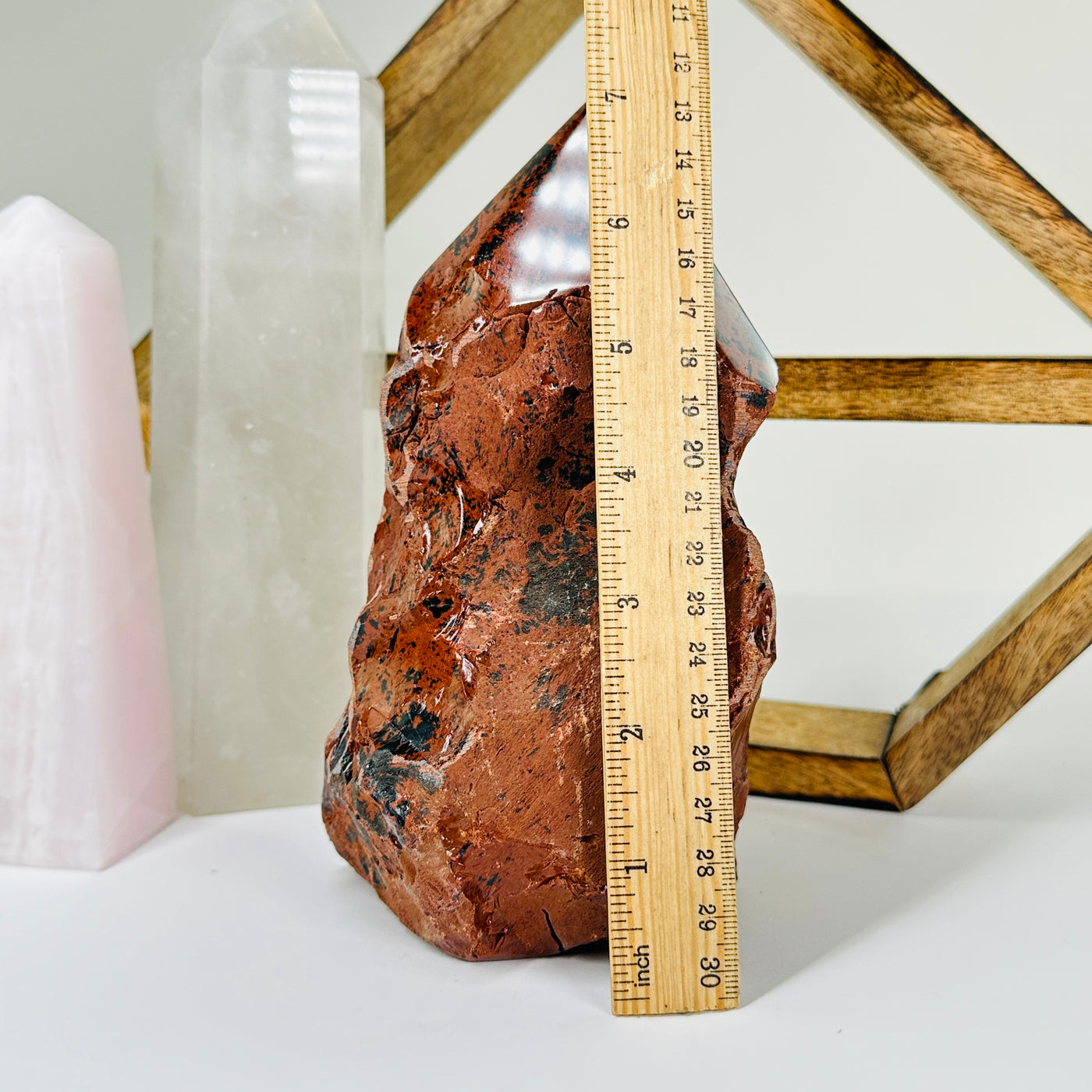 Mahogany obsidian with decorations in  the background